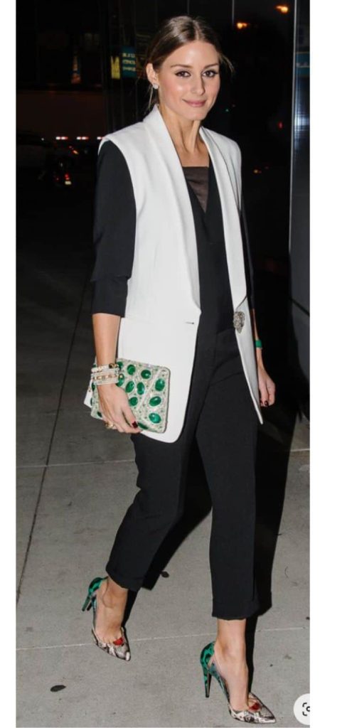 white sleeveless blazer and black dress