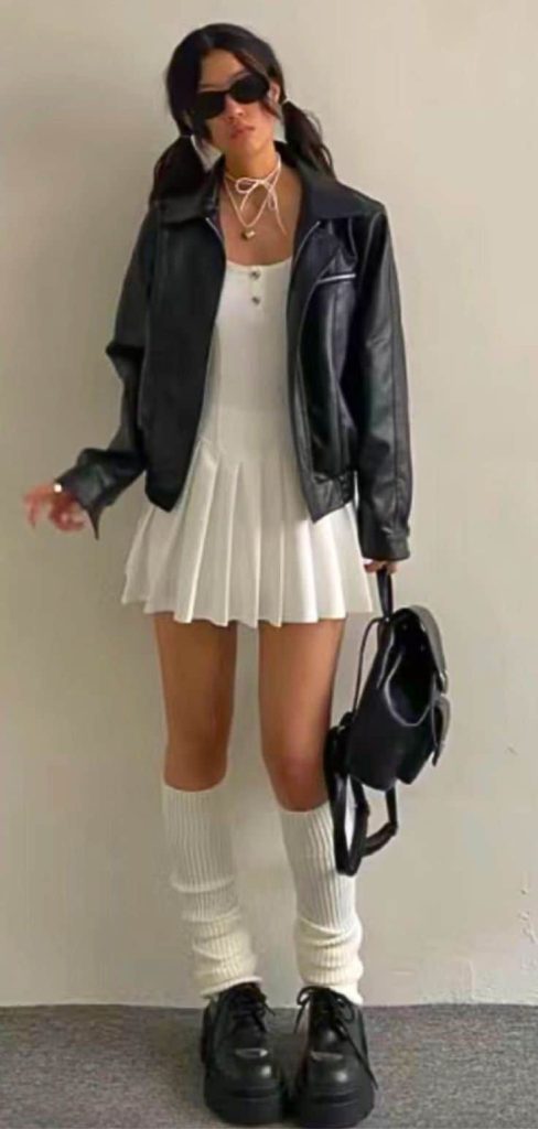 short pleated skirt and white leg warmers