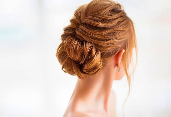 Try a different hairstyle to look more feminine without makeup