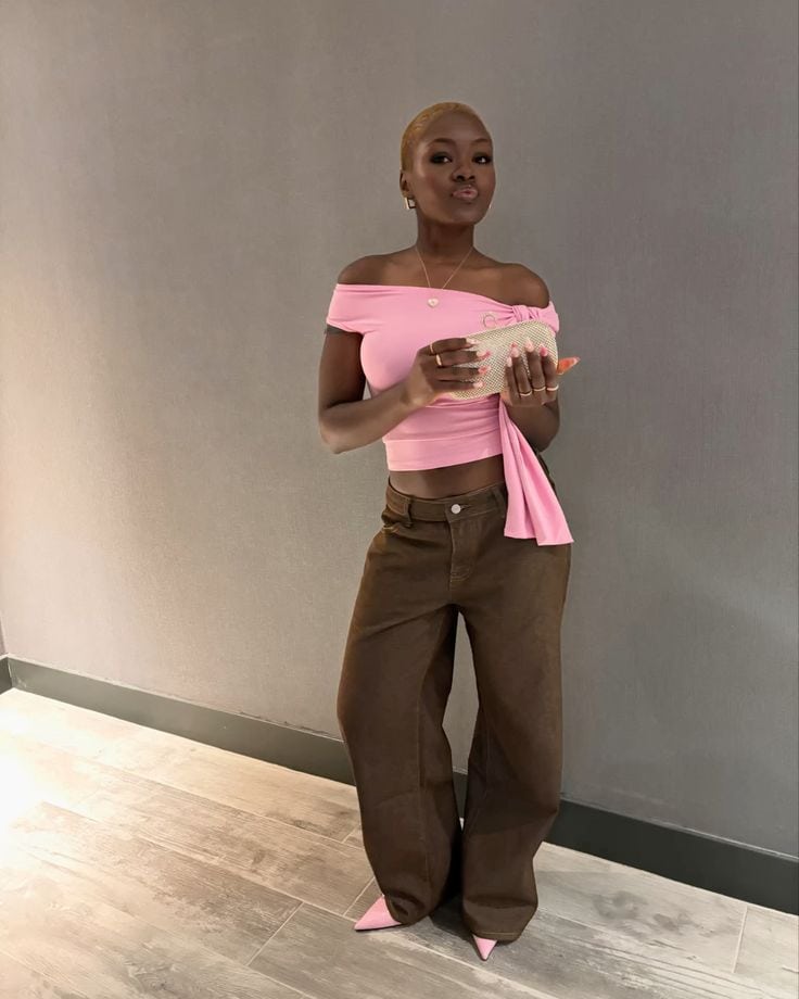 pink top and brown pants