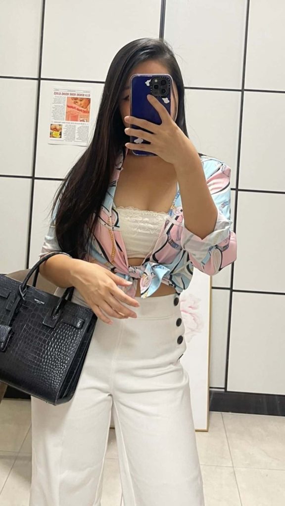 colorful cropped shirt and white jeans