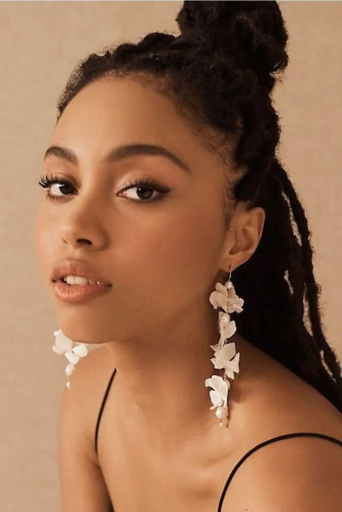 look feminine wearing long earrings