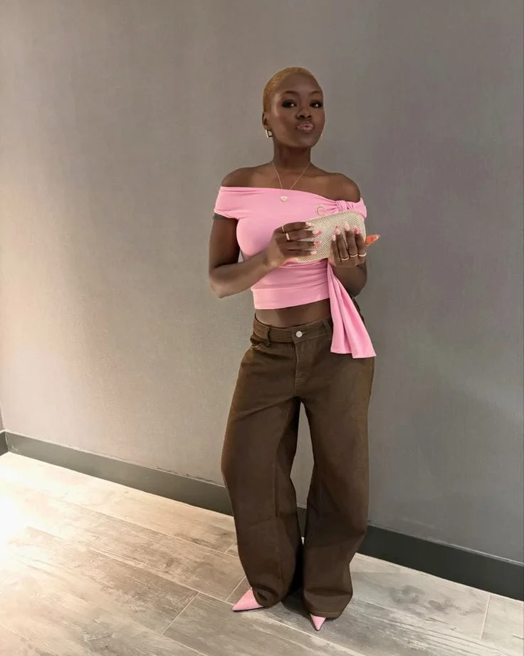 pink top and brown pants