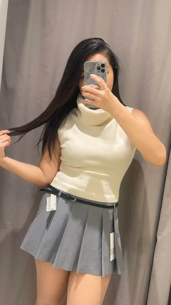 white sleeveless knit top pleated skirt
